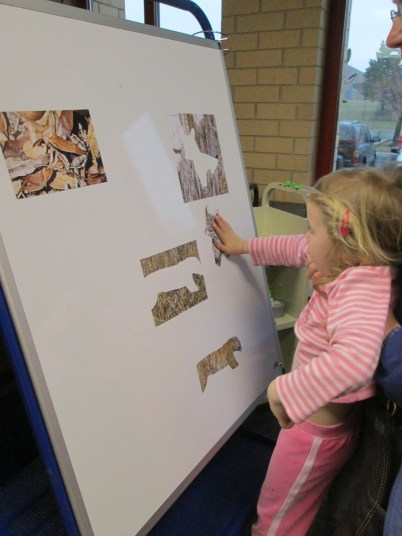 Girl playing with magnet paper